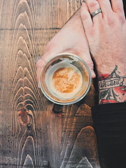 Close-up of a hand-carved horn mug with intricate Nordic patterns.