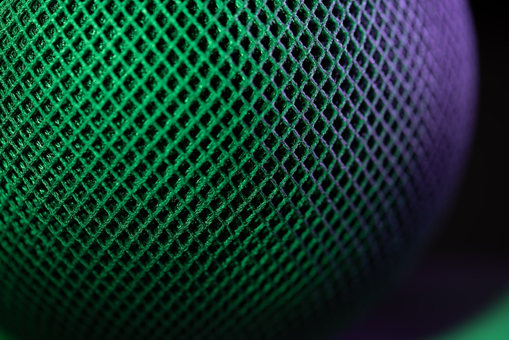 a close up of a green and purple object