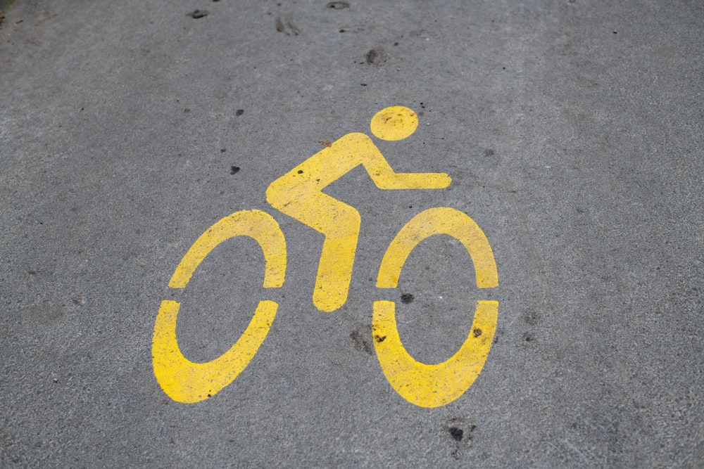 a yellow bicycle lane with a man on it