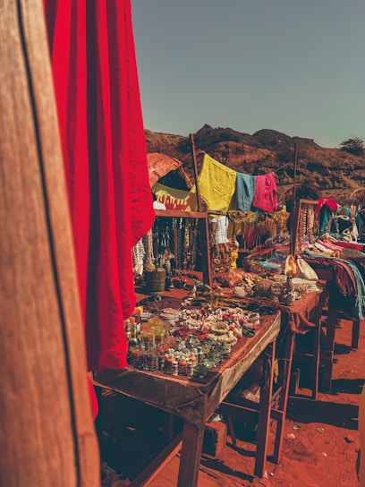 A vibrant Colombian market scene with colorful fruits and handmade crafts under bright sunlight