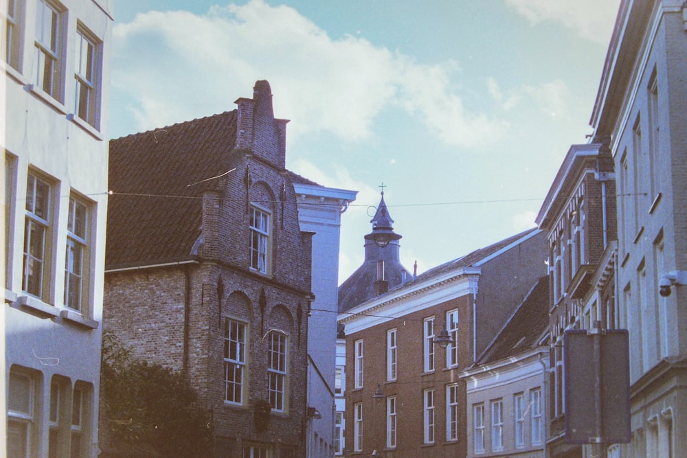 a city street lined with tall brick buildings