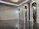 Close-up of a polished marble floor reflecting natural light in a cozy living room.