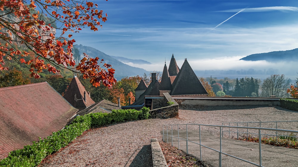 a scenic view of a castle in the mountains