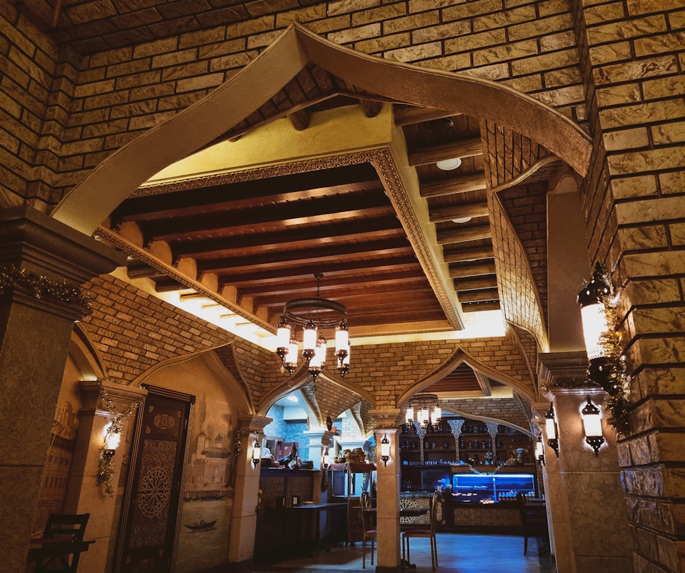 a room with a ceiling made of wood and stone