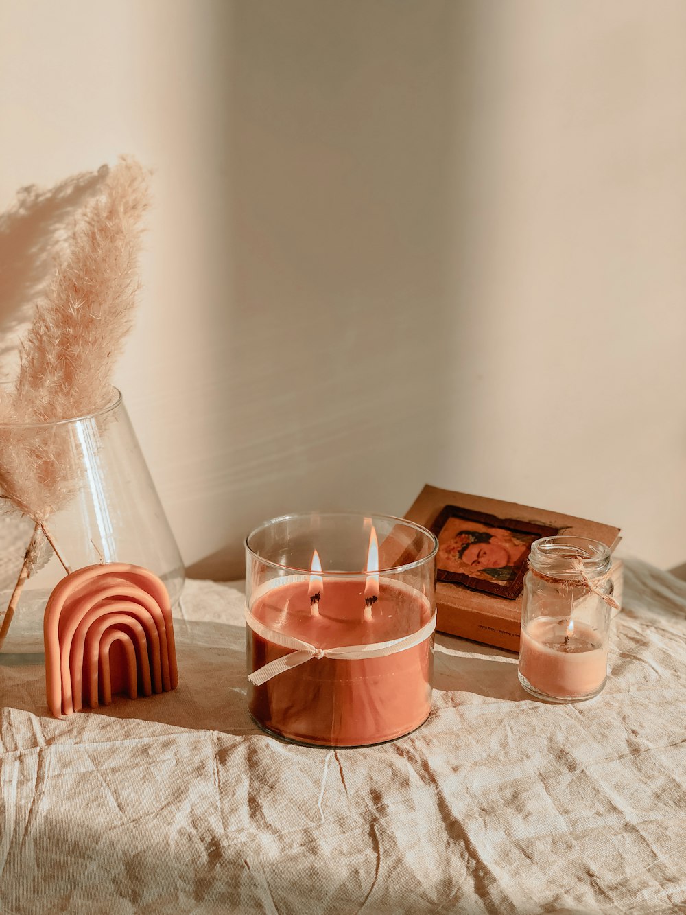 a table with a candle and a box of matches