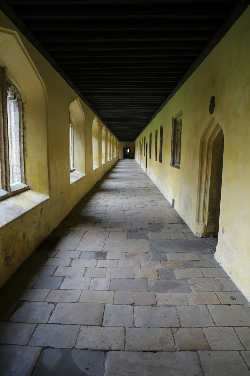 a long hallway lined with windows next to each other
