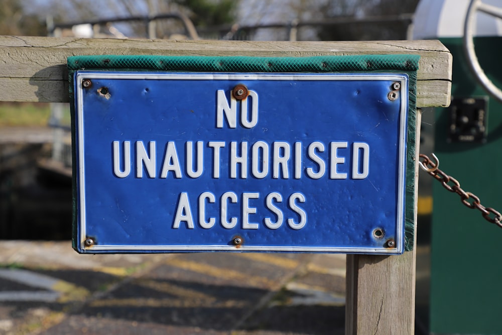 a blue sign that says no unauthrised access