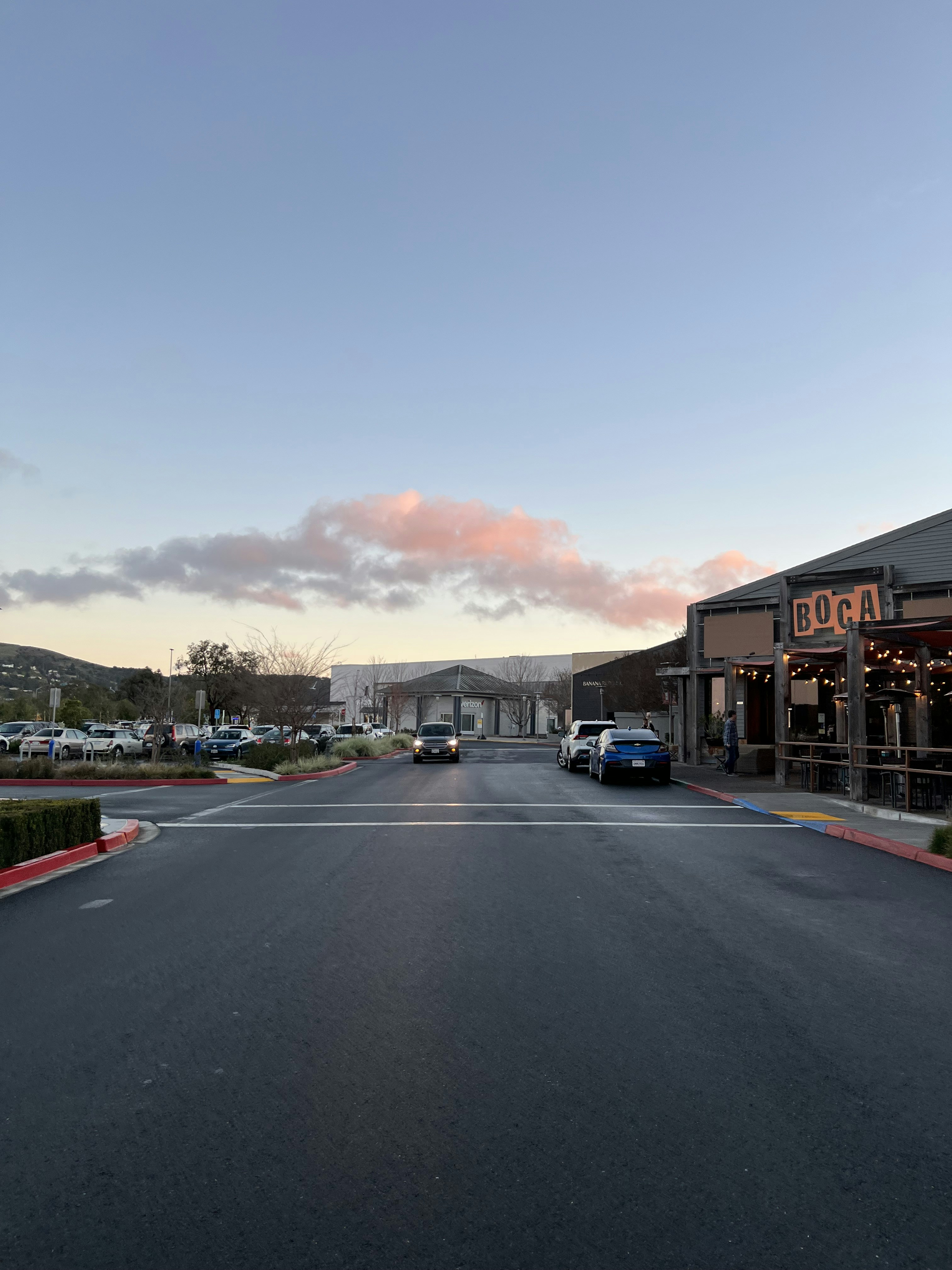 a street with cars parked on the side of it