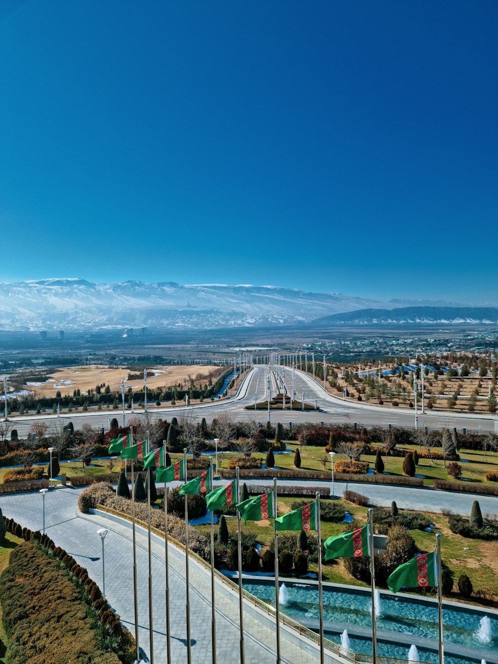 an aerial view of a highway and a parking lot