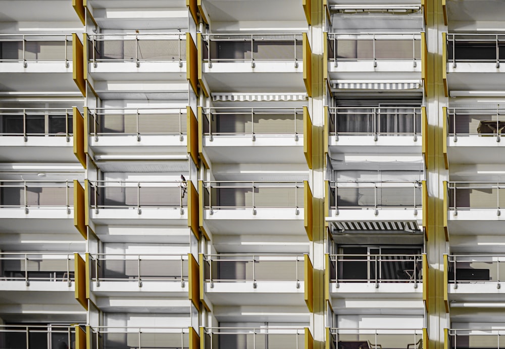 an apartment building with balconies and balconies on each floor