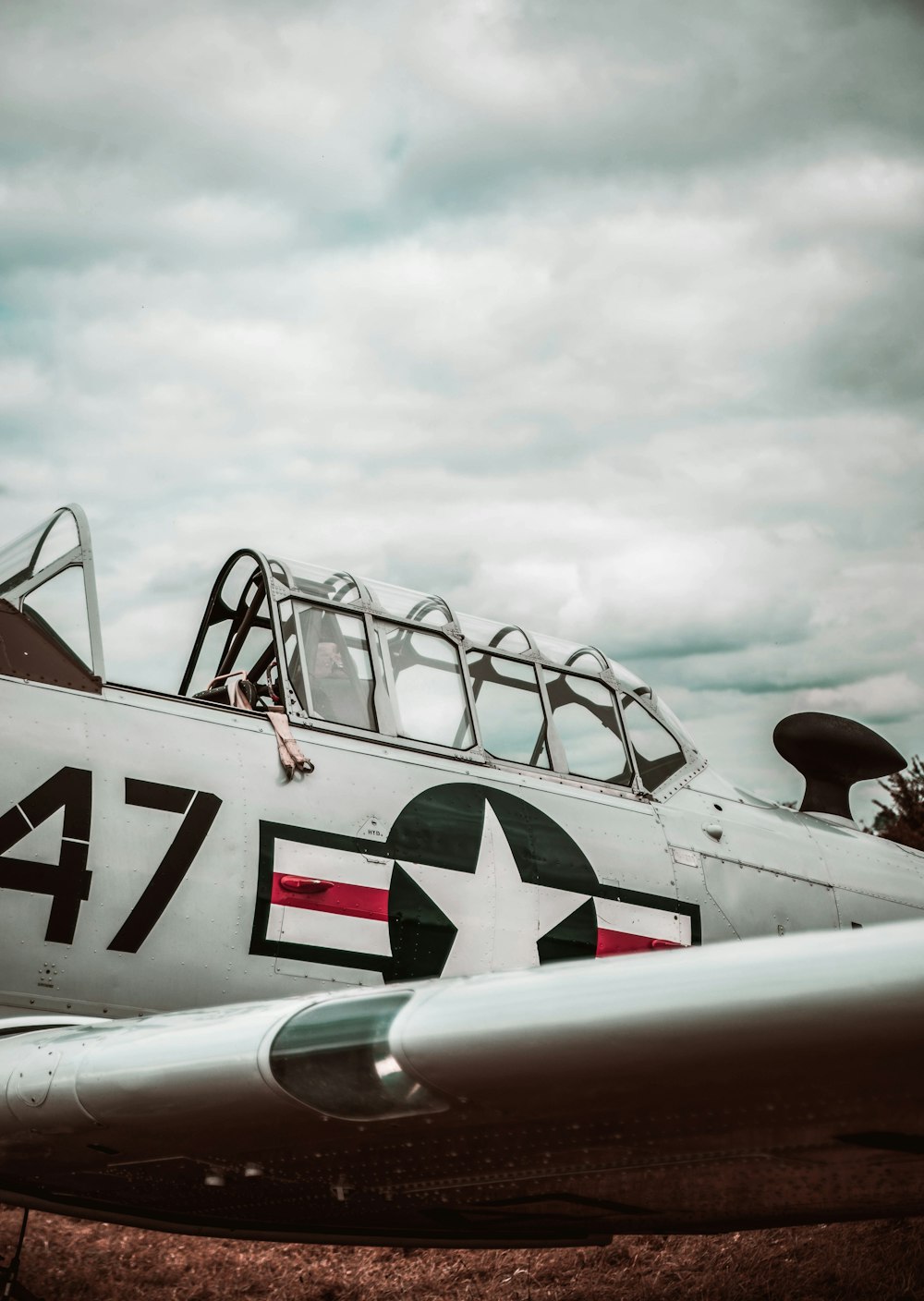 an old world war ii fighter plane sitting on the ground