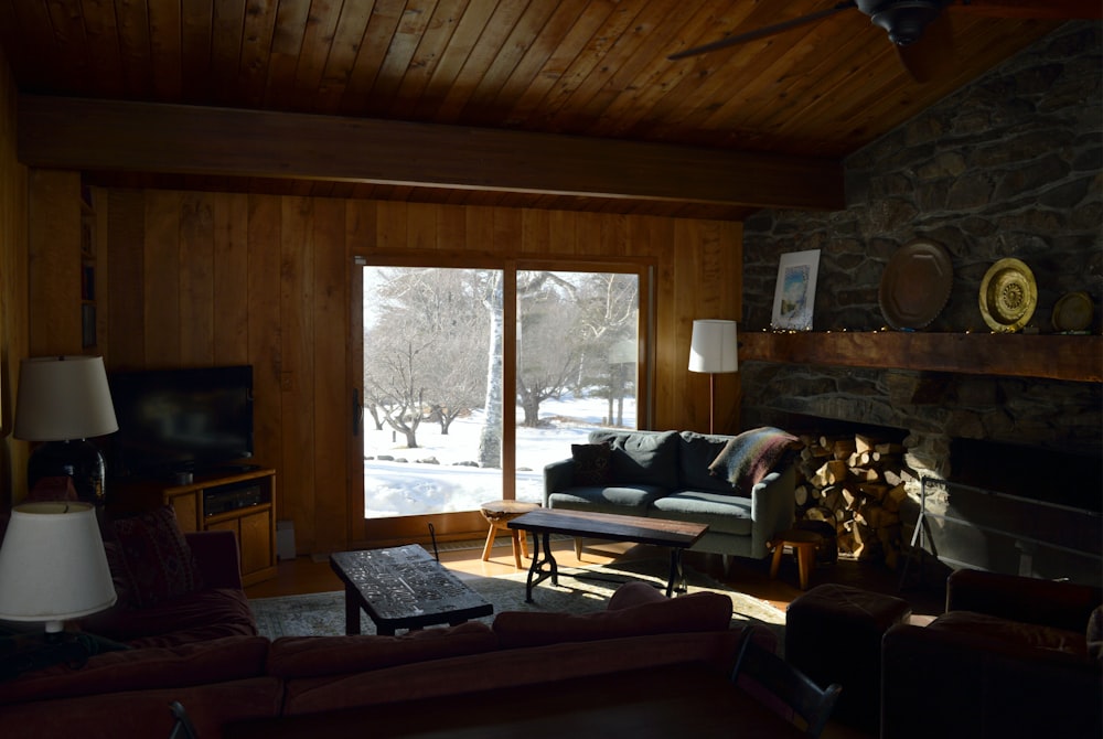 a living room filled with furniture and a fire place