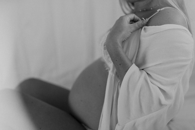 A close-up of a pregnant woman consulting with a doctor, illustrating pregnancy check-up.