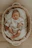 Close-up of essential newborn accessories neatly arranged inside a nestling basket.