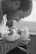 Father gently cradling his premature baby in a cozy nursery with soft lighting.