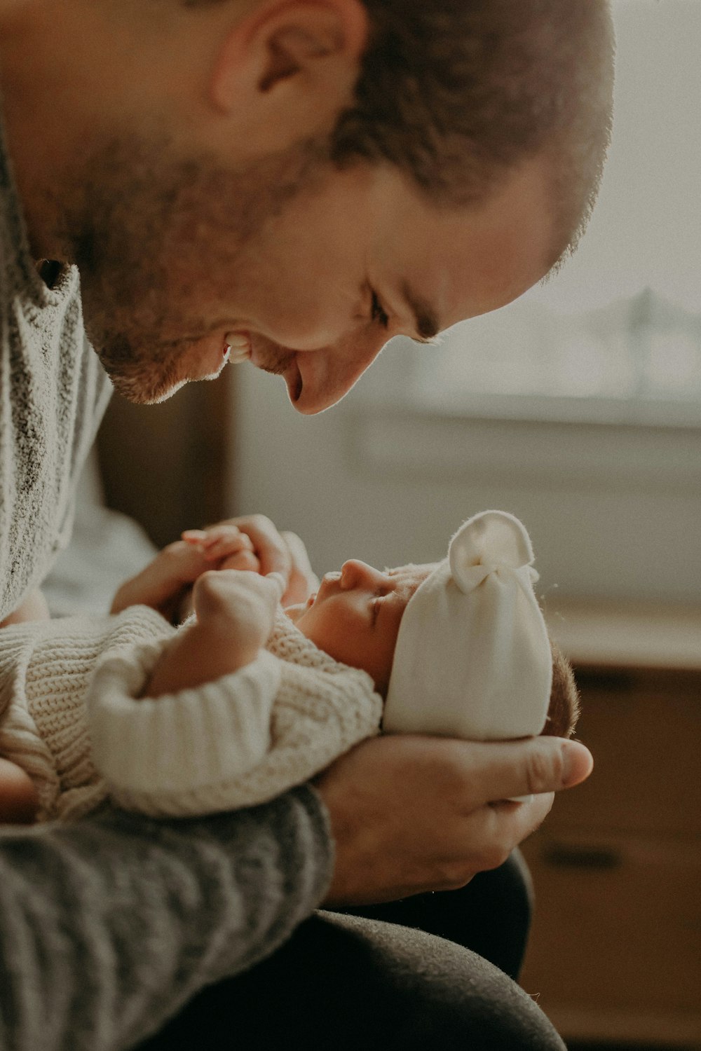 a man holding a baby in his arms