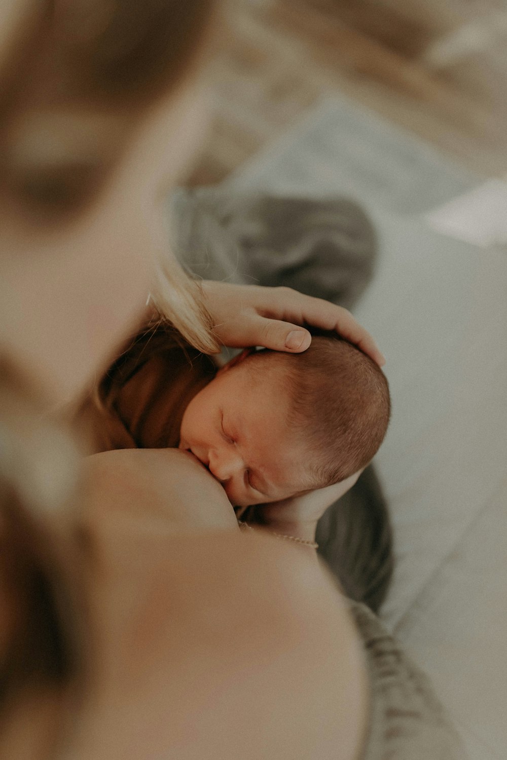 a woman holding a baby in her arms