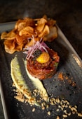a plate of food with potato chips on it