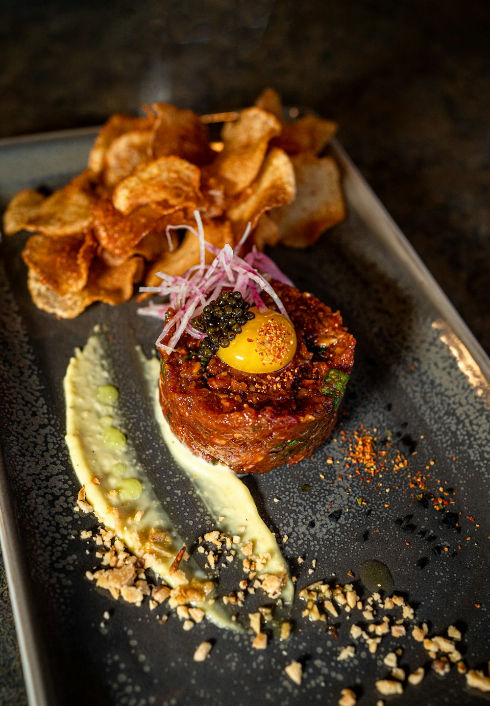 a plate of food with potato chips on it