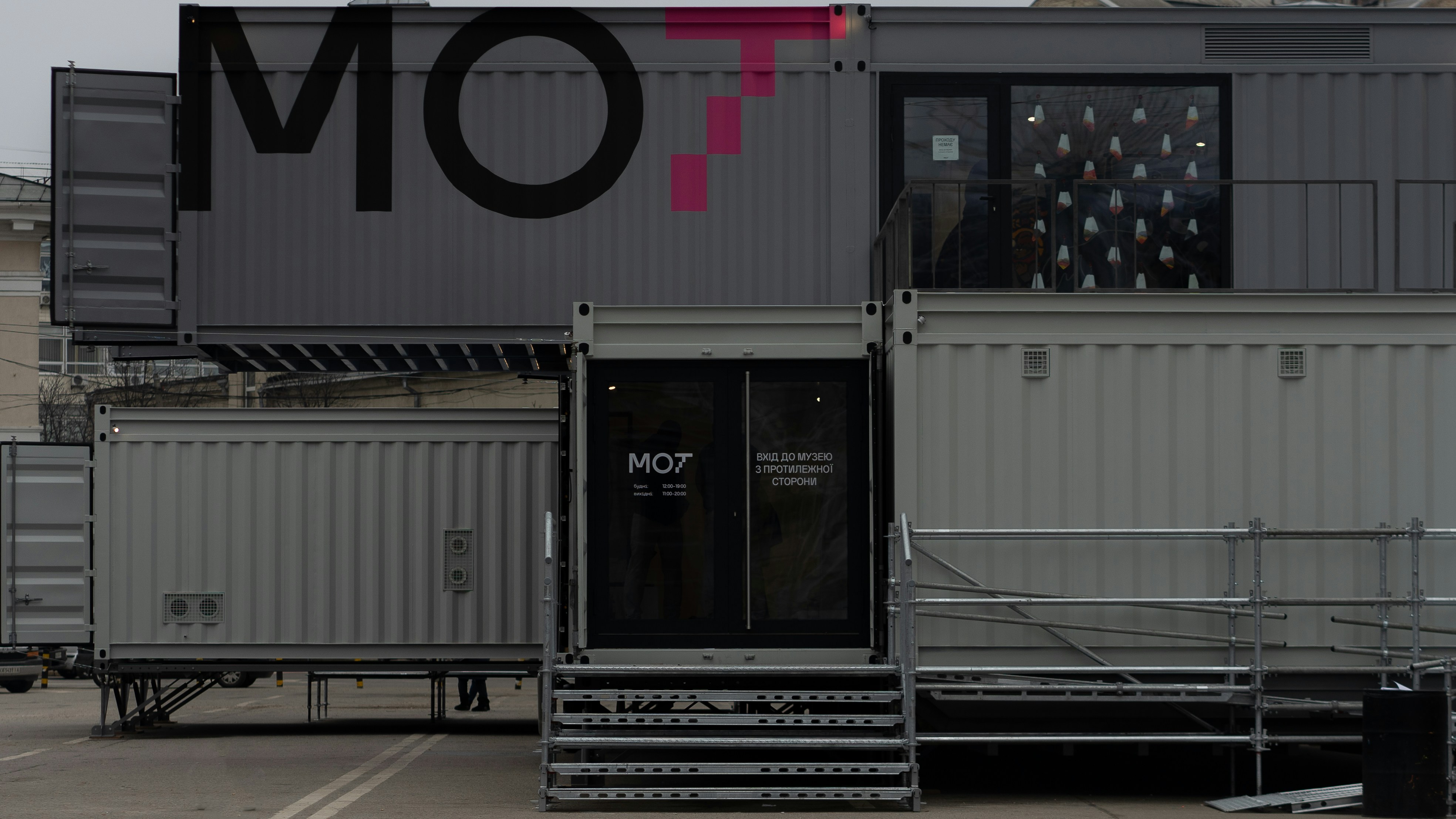 a couple of shipping containers sitting next to each other
