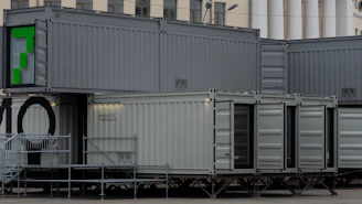 a row of shipping containers sitting next to each other