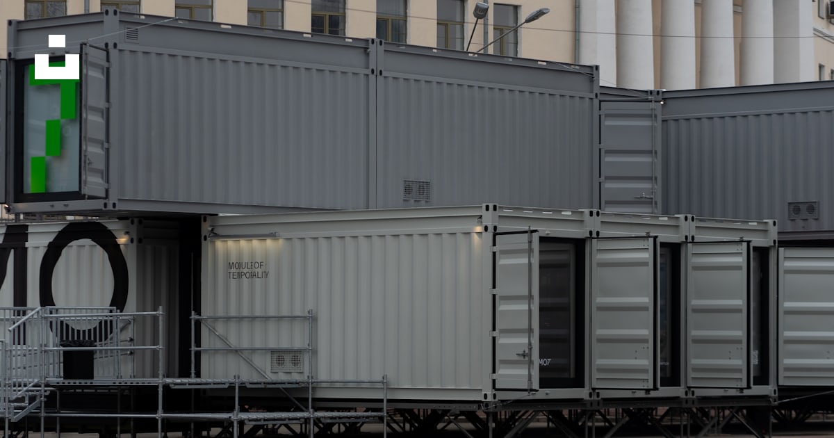 A row of shipping containers sitting next to each other photo – Free ...