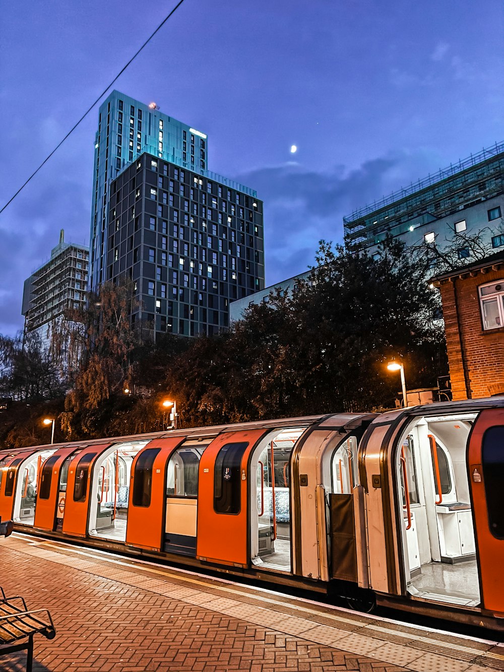 a train is parked on the tracks in a city