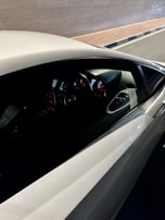 Instructor and student reviewing road test tips inside the car before a lesson.