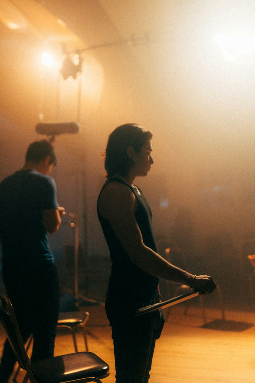 a woman standing in front of a camera in a room