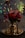 A richly decorated floral arrangement features vibrant red and pink flowers placed in a golden vase, accented with intricate metallic candle holders. Behind the flowers, a multi-colored, illuminated umbrella adds a festive and magical atmosphere with its glowing lights.