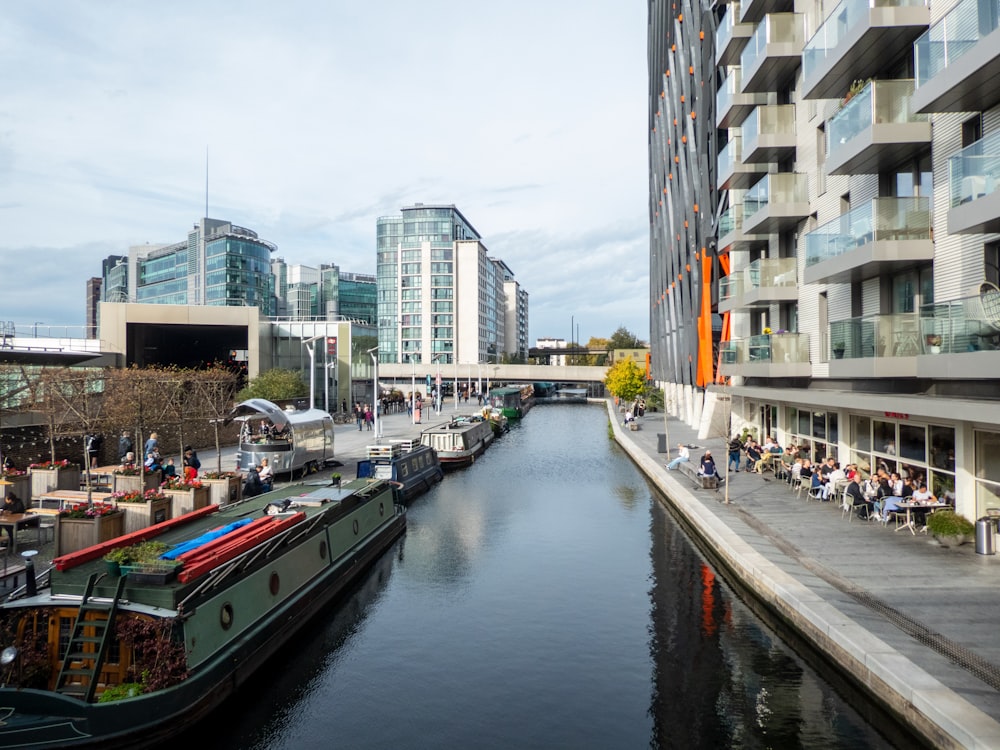 a river running through a city next to tall buildings