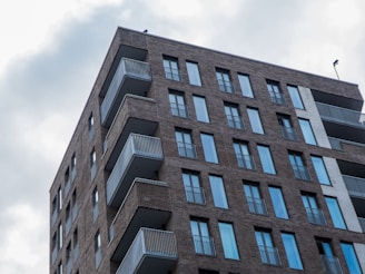 a tall brick building with balconies and balconies