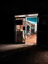 A warm, inviting photo of the memoriafábrica storefront in Manta with soft natural light