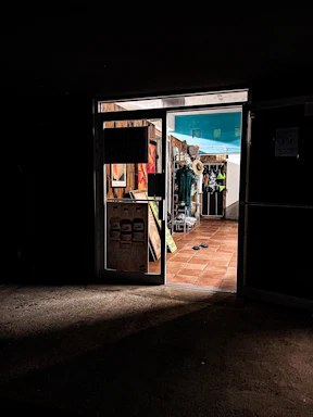 A warm, inviting photo of the memoriafábrica storefront in Manta with soft natural light