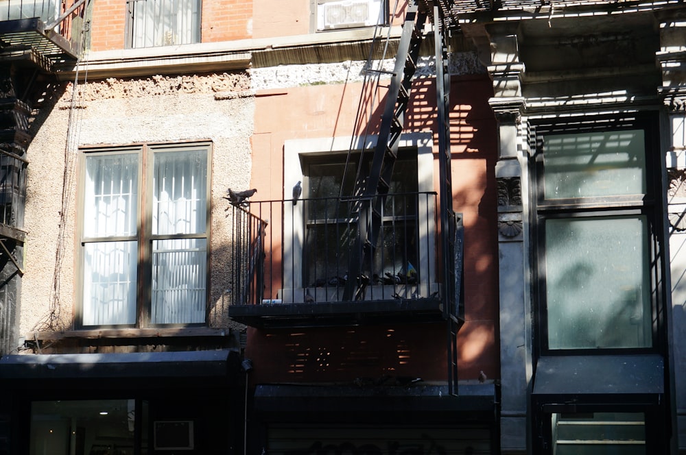 an apartment building with a bicycle parked on the balcony