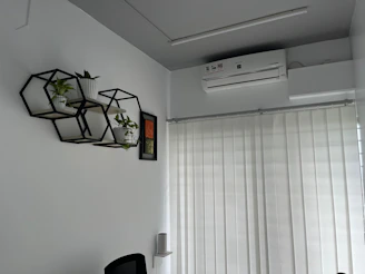 Modern office space with a solar-powered air conditioner mounted on the wall.