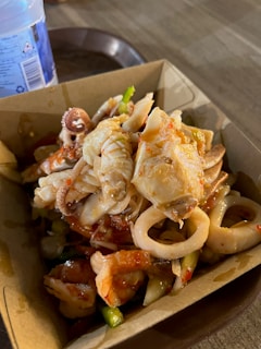 a box filled with food sitting on top of a table