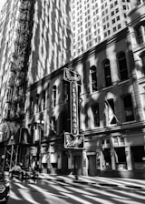 A vintage black-and-white photo of the original Popular Mutton Shop storefront from the late 1800s.