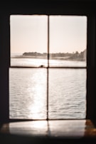 A calm window view with gentle sunlight, suggesting hope and new perspectives.