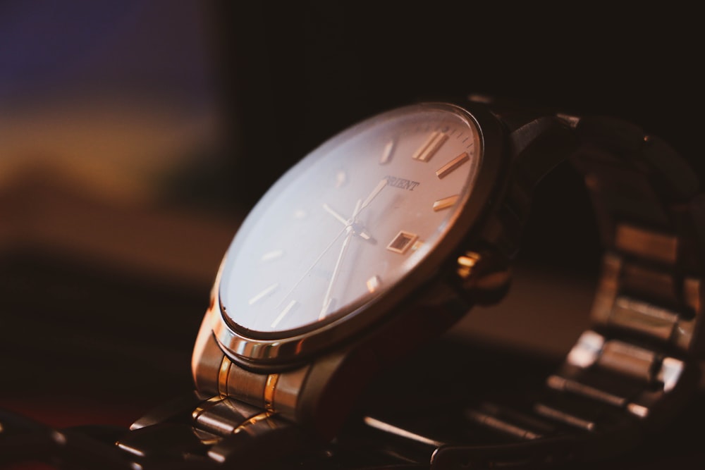 a close up of a watch on a table