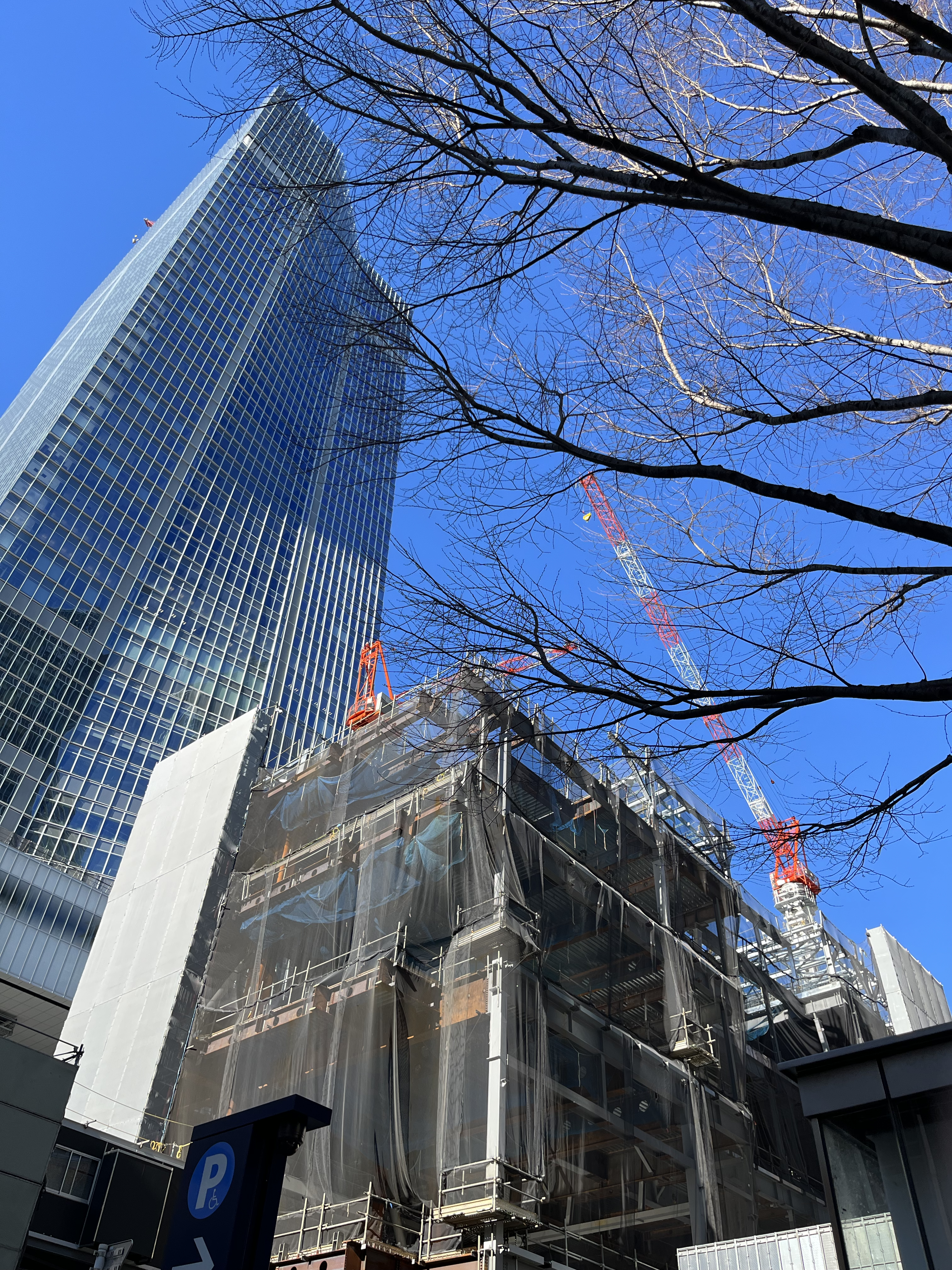 a tall building with a crane on top of it