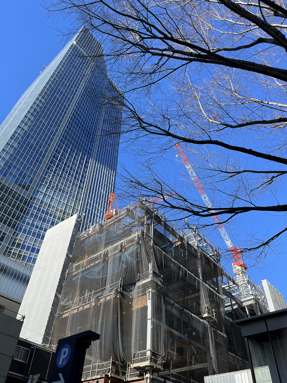 a tall building with a crane on top of it