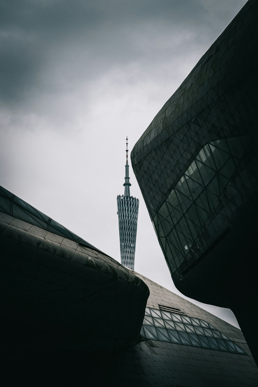 a tall building with a sky scraper in the background