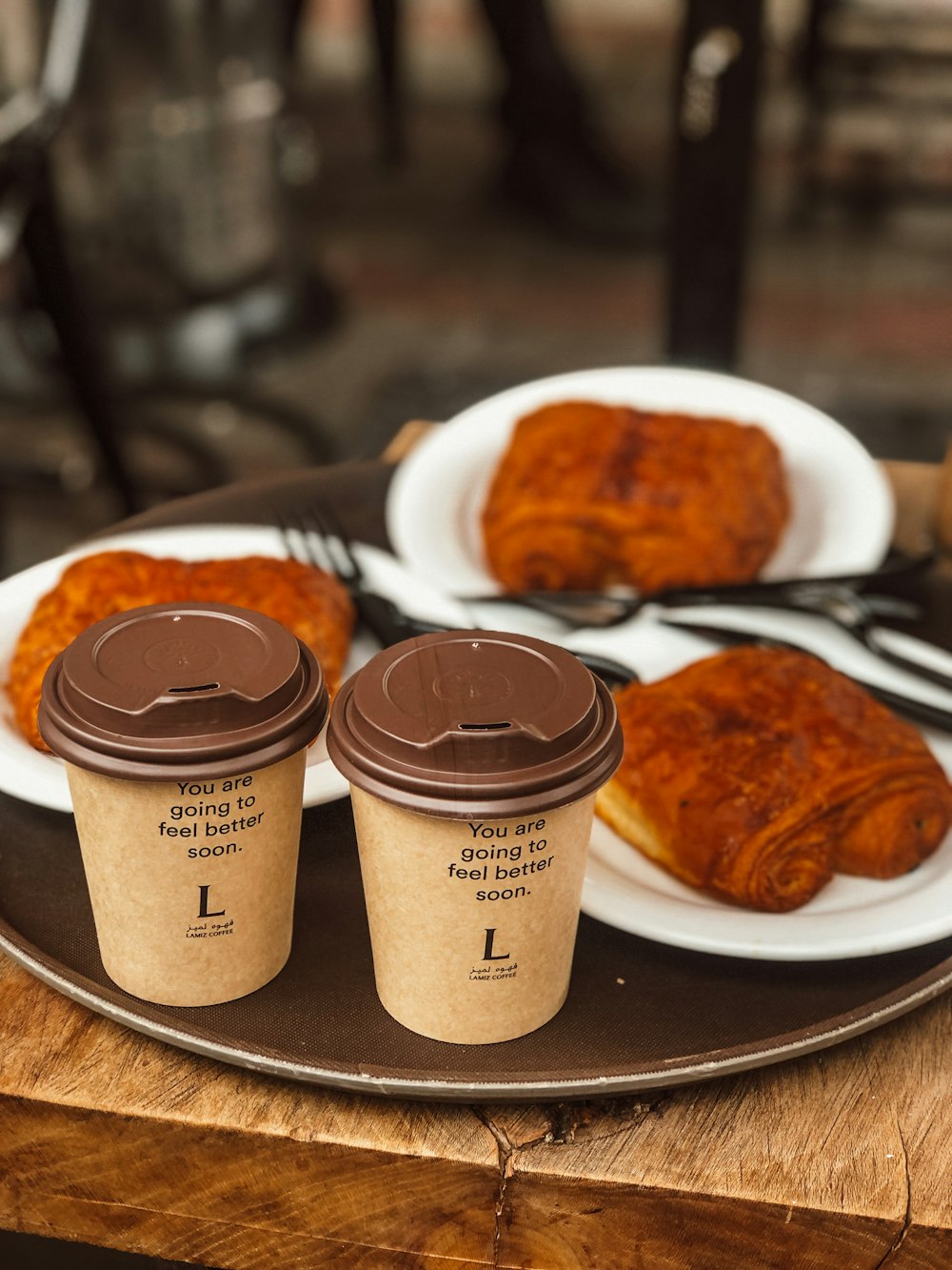 a couple of cups of coffee sitting on top of a plate