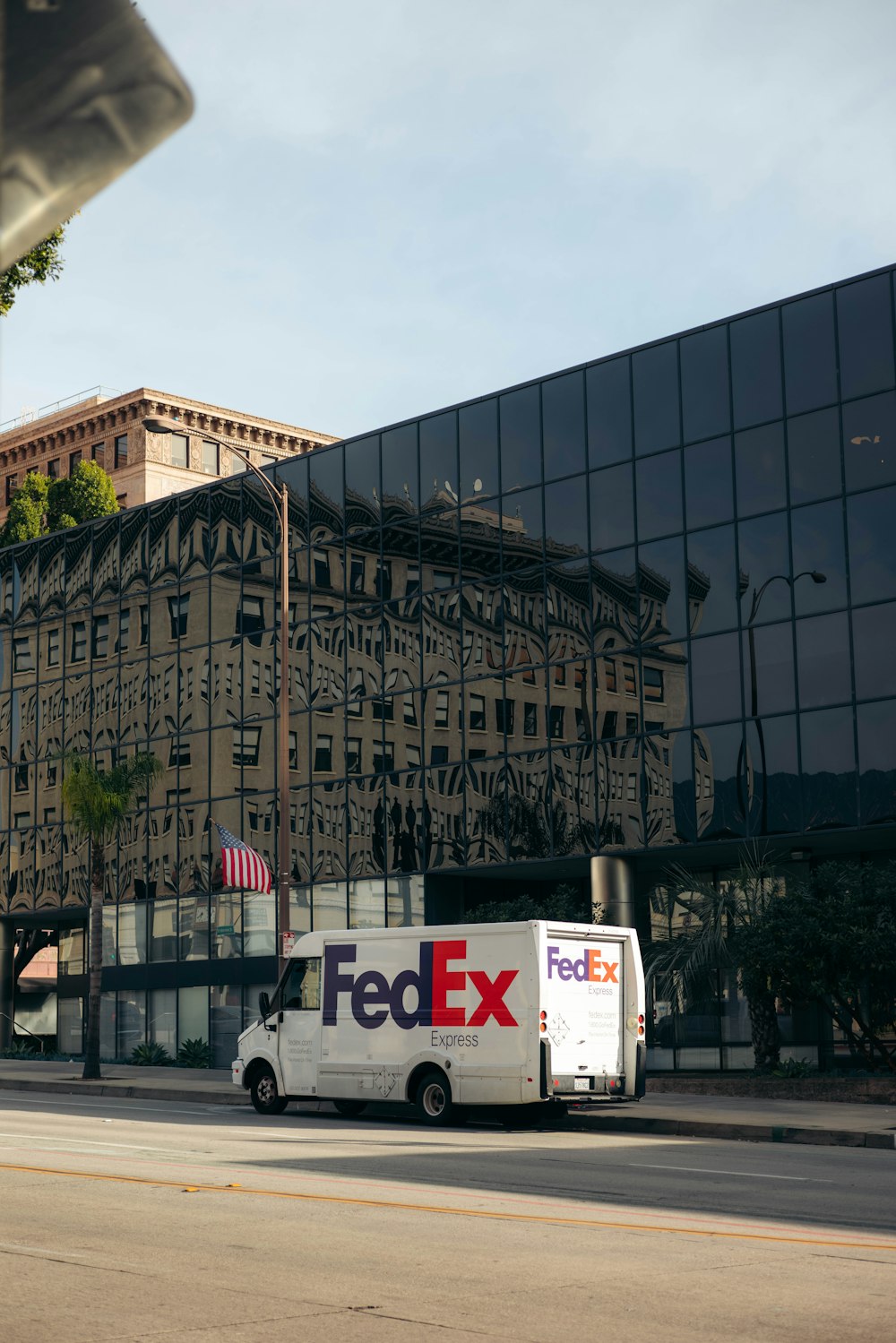 a fed ex truck parked in front of a building