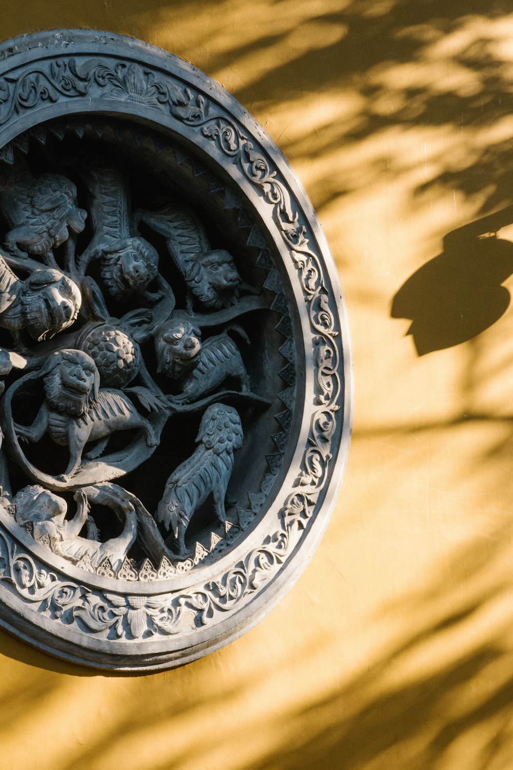 a sculpture of a group of people in a bowl