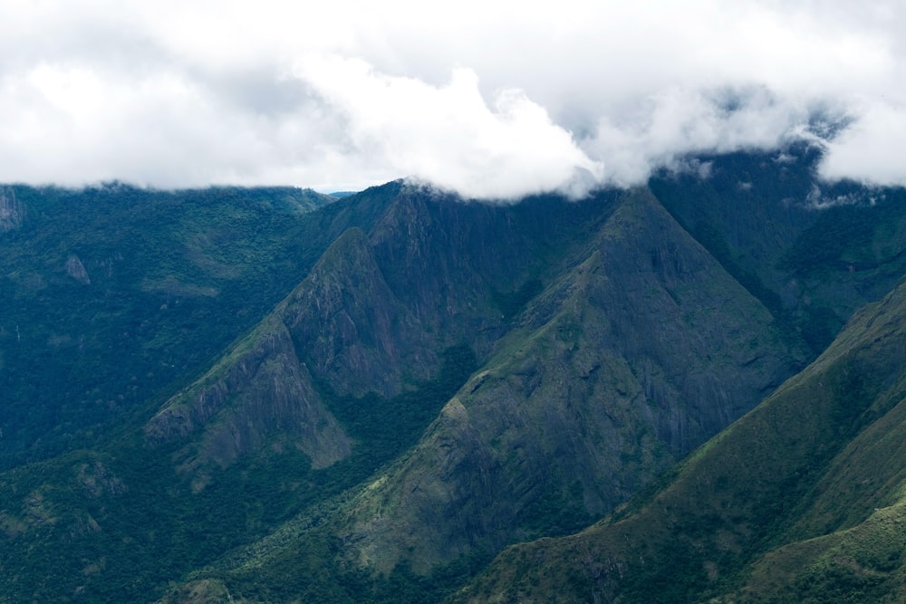 a view of a mountain range with clouds in the sky