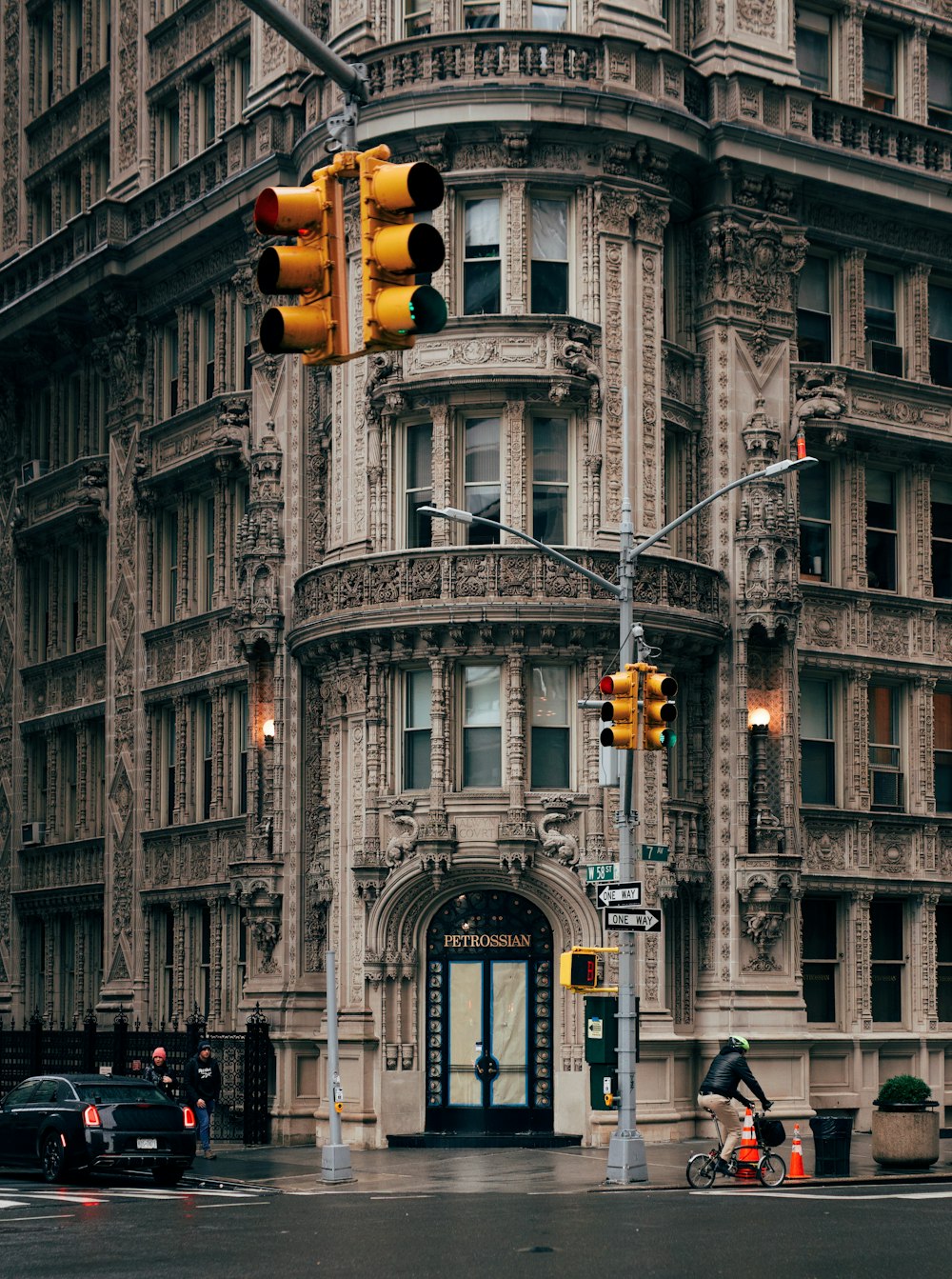 a traffic light on a pole in front of a building