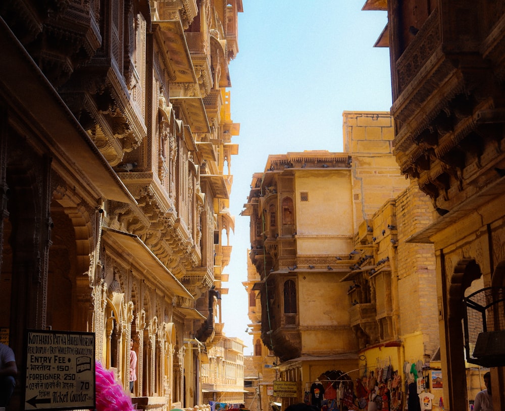 a narrow street in a city with old buildings