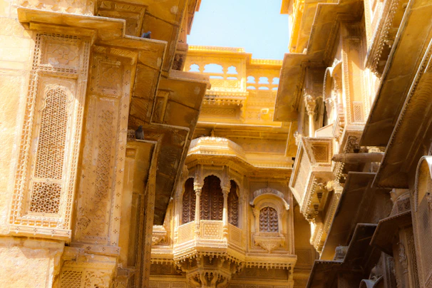Intricate carvings on the ancient Jaisalmer Fort walls bathed in warm light.
